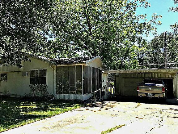 Double Car Driveway with 2 car carport AND 2 car garage.