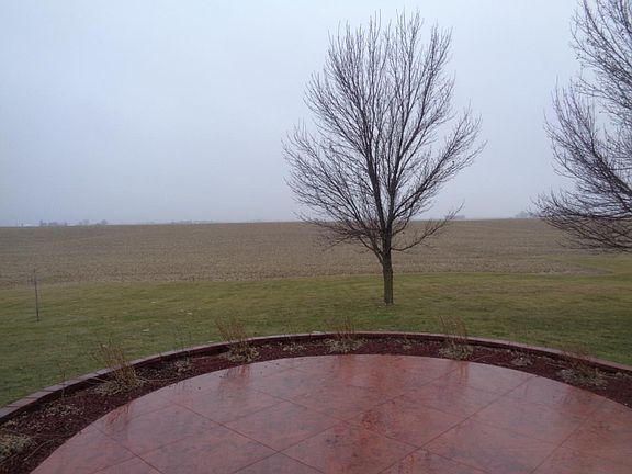 Stamped patio overlooking Iowa corn fields