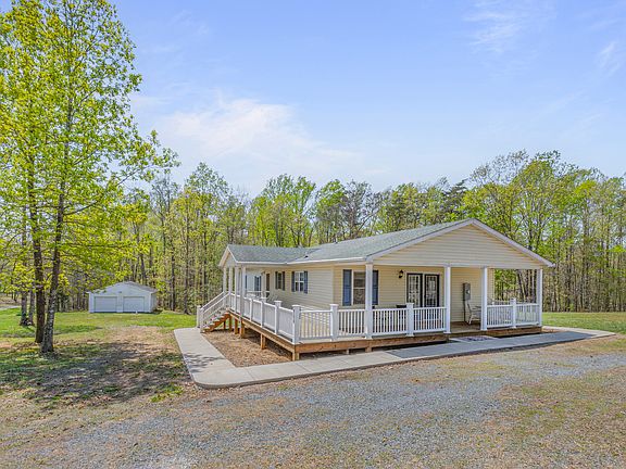 Located on 3 private acres with detached storage building