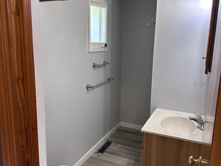 bathroom, stand up shower is down on the end to the right.