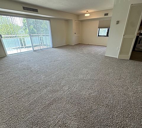 Sliding doors to balcony, just outside of living area.
