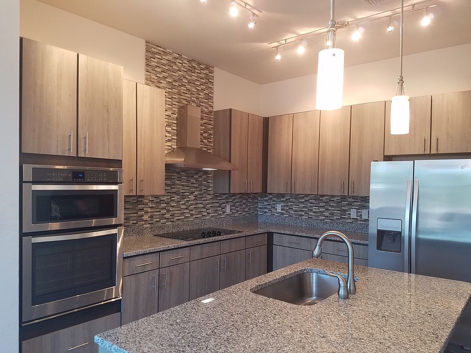 Picture of a 3 bedroom with similar cabinets, counters and i