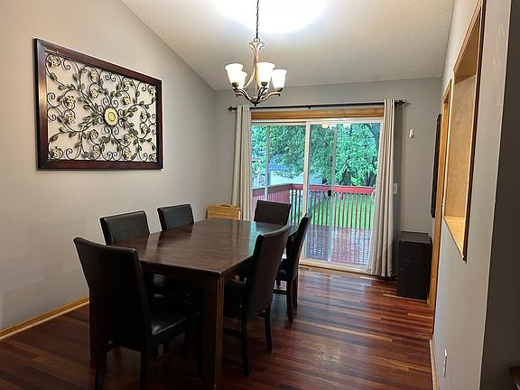 dining room (main floor) with sliding patio door out to deck.