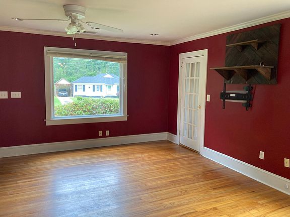 Living room window, door to laundry room.