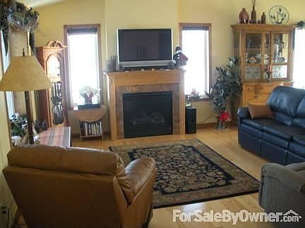 Living room with gas fireplace : Wood floors throughout main floor