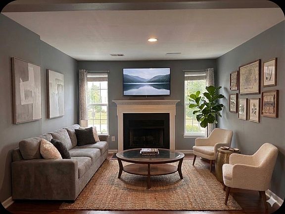 The living room has a fireplace, but the rest here is virtually staged.