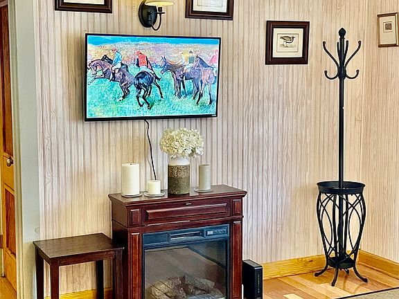 Flat Panel Wall Mounted Smart TV and Electric Fireplace