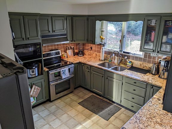 Kitchen with double oven and new Bosch dishwasher (not visible, under counter at right).