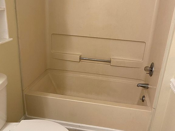 b3 full bathroom with tile flooring