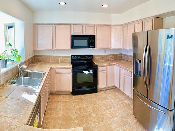 Beautiful kitchen with newer Samsung stainless fridge; microwave and range also to be replaced with brand-new Samsung stainless