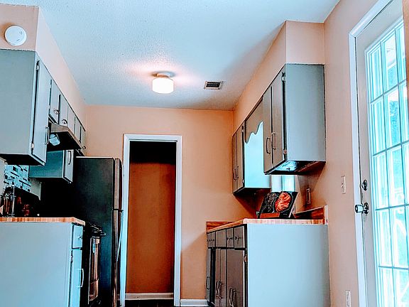Kitchen and eating area looking from the family and laundry room.