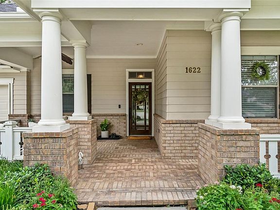 Imagine walking up to this lovely site after a long day! Classic details including brick porch, columns and wood shutters!