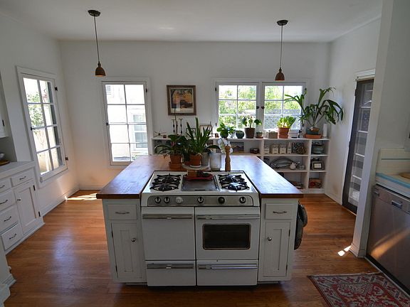 Best kitchen space in LA, windows on three walls and looks out on and opens onto back yard.