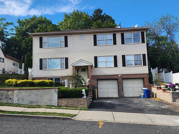 2nd Floor Unit with 1 Attached Garage with opener. 1 Car Space and Ample Street Parking