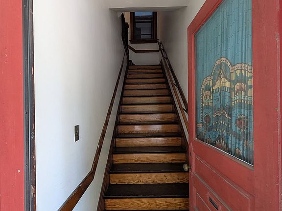 entryway and stairs up to the unit