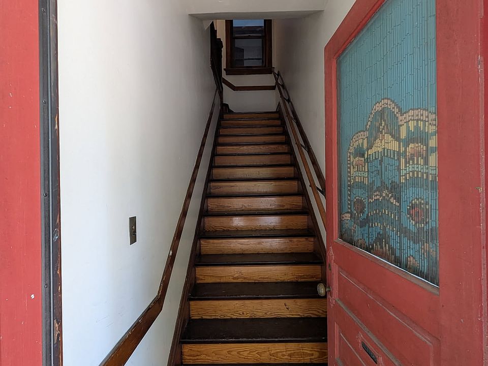 entryway and stairs up to the unit