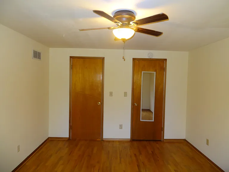 Master bed with fan, mirror, Smoke and Carbon monoxide detector, Large window with blinds.