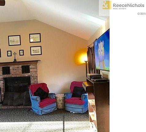 Part living room view onto Brick fireplace