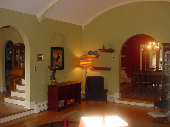 Beautiful front hall leads to formal living room, library or kitchen.