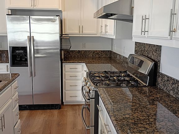 All stainless steel appliances, including dishwasher. Beautiful marble countertops.