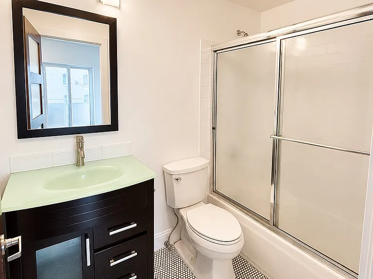 Private full bathroom conveniently connected to the guest bedroom.