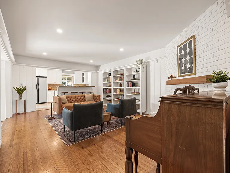 Secondary living room connected to the kitchen and dining area.