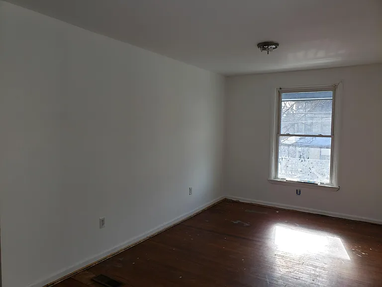 Master Bedroom, big enough to fit a King Bed AND a 5pc bedroom set. It is absolutely huge and beautifully lit by sunlight with newly refinished natural hardwood floors.