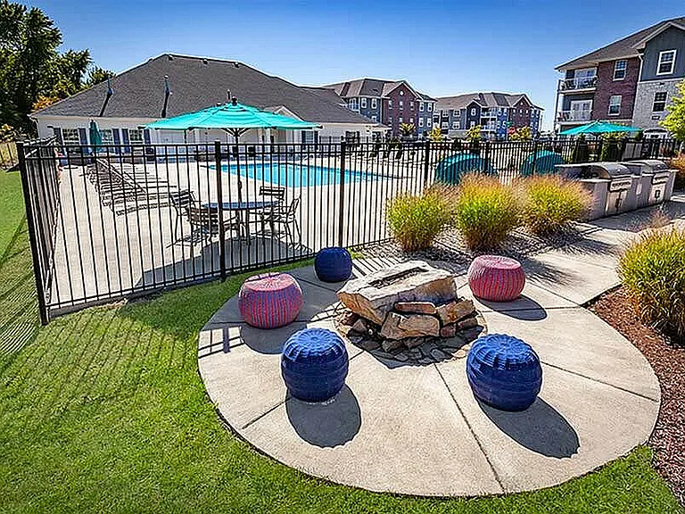 Lounge fireside, grill with friends, or take a dip_this outdoor space brings together all the best parts of a summer evening.