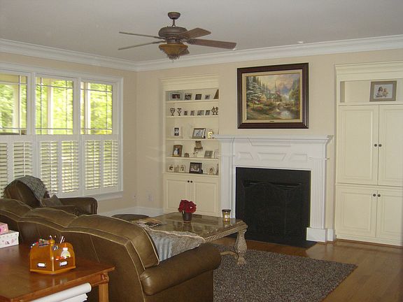 Family Room-Wall of windows, built-ins and hardwood floors!