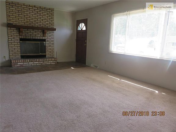 Living Room w/ Wood burning Fireplace