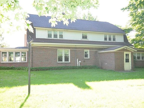 BACK OF HOUSE {ENCLOSED PORCH TO THE LEFT}
