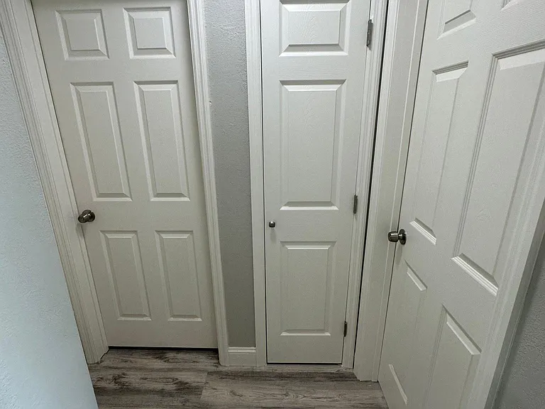 Hallway (Doors Left to Right - Bedroom 2, Closet, and Bedroom 1)