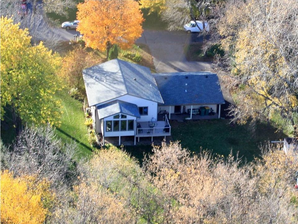 NESTLED IN THE WOODS! GOLF COURSE OUT YOUR BACK DOOR! Quiet cut off neighborhood!