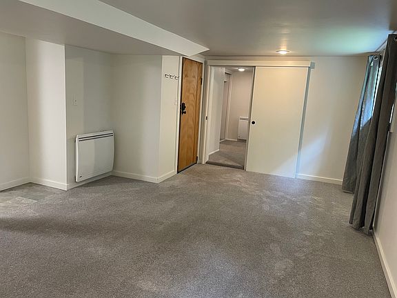 Livingroom (facing east towards the entry door and the bedroom door)