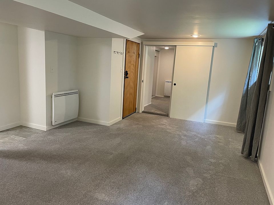 Livingroom (facing east towards the entry door and the bedroom door)