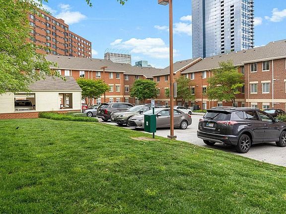 Grassy area for pet relief off of back parking lot.