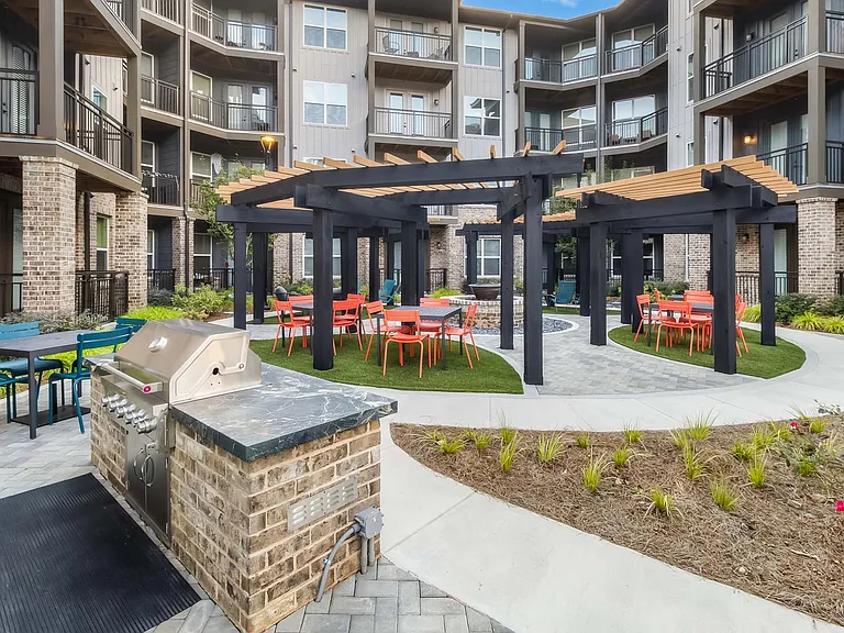 Step outside to a courtyard made for connection, comfort, and calm