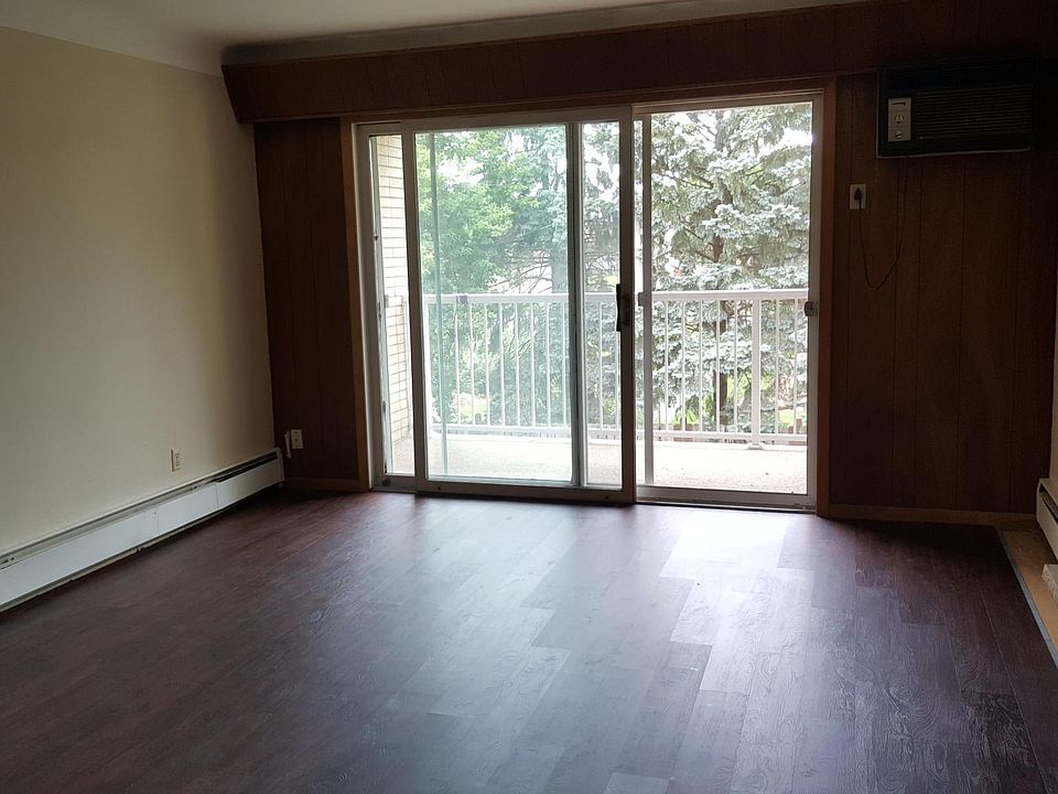 Living room with fireplace and balcony. 