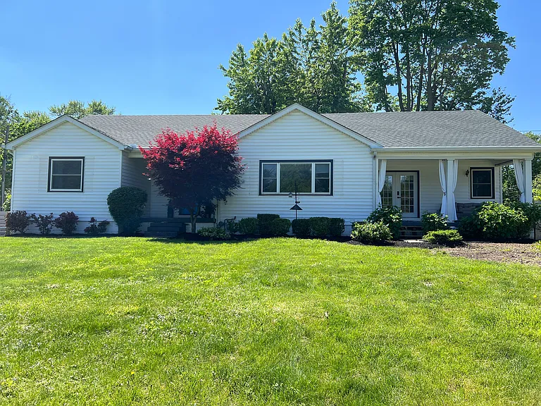 Huge, fully-fenced front yard.