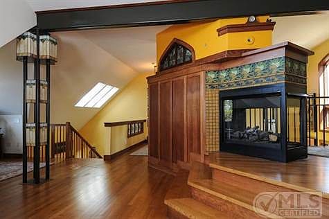Second floor fireplace and ornate craftmanship and stained glass work.