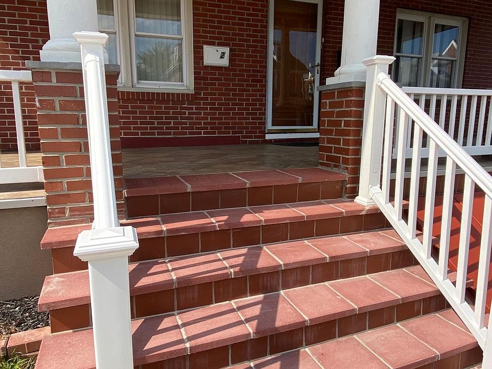 Large impressive brick and tile front porch.