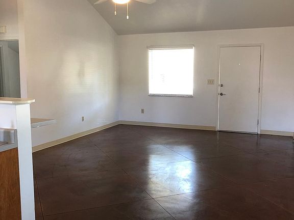 View of living area/front door from the kitchen
