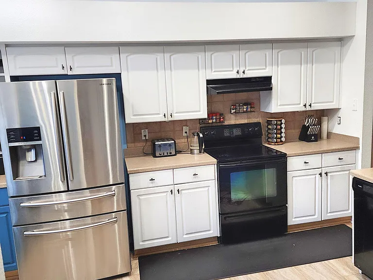 Stainless fridge and stove.