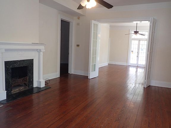 Living area with french doors that open up to bedroom number