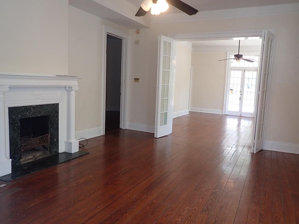 Living area with french doors that open up to bedroom number