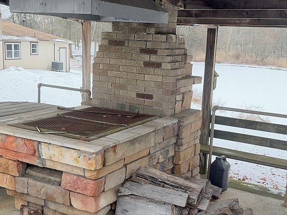 Firepit. Great place to hang out and cook. Overlooks the pond.