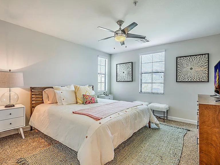 Step into comfort at The Michael B: Freshly painted walls, updated carpet, and a soothing ceiling fan make every moment serene.