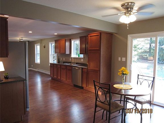 The attractive kitchen features an eat in area with new sliding door leading to the new deck. Engineered hardwood flooring flows seamlessly throughout.