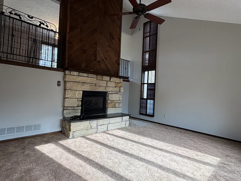 Living room with high ceiling.