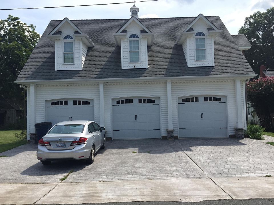 The 1BR apartment is located above the garage.